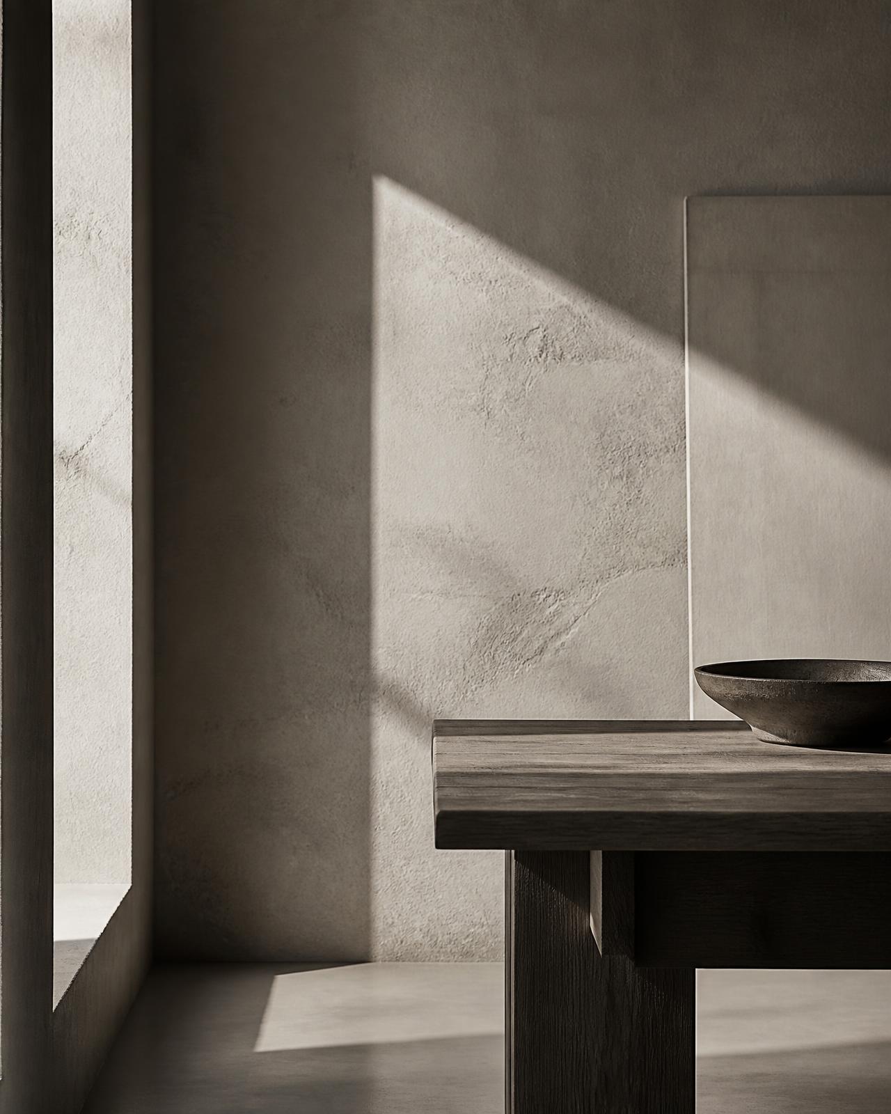 Intérieur d'atelier contemporain, lumière naturelle sur un mur de plâtre